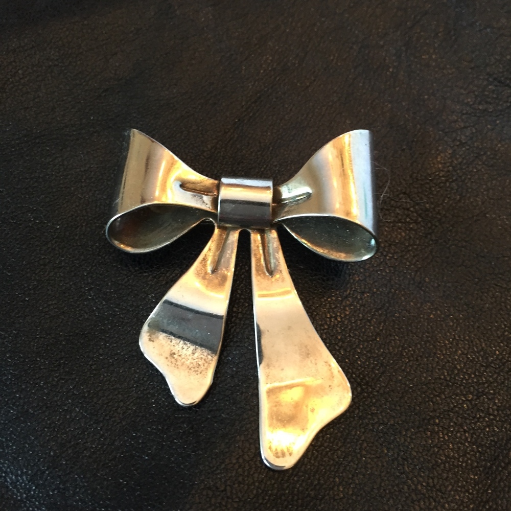 Silvertone bow pin brooch